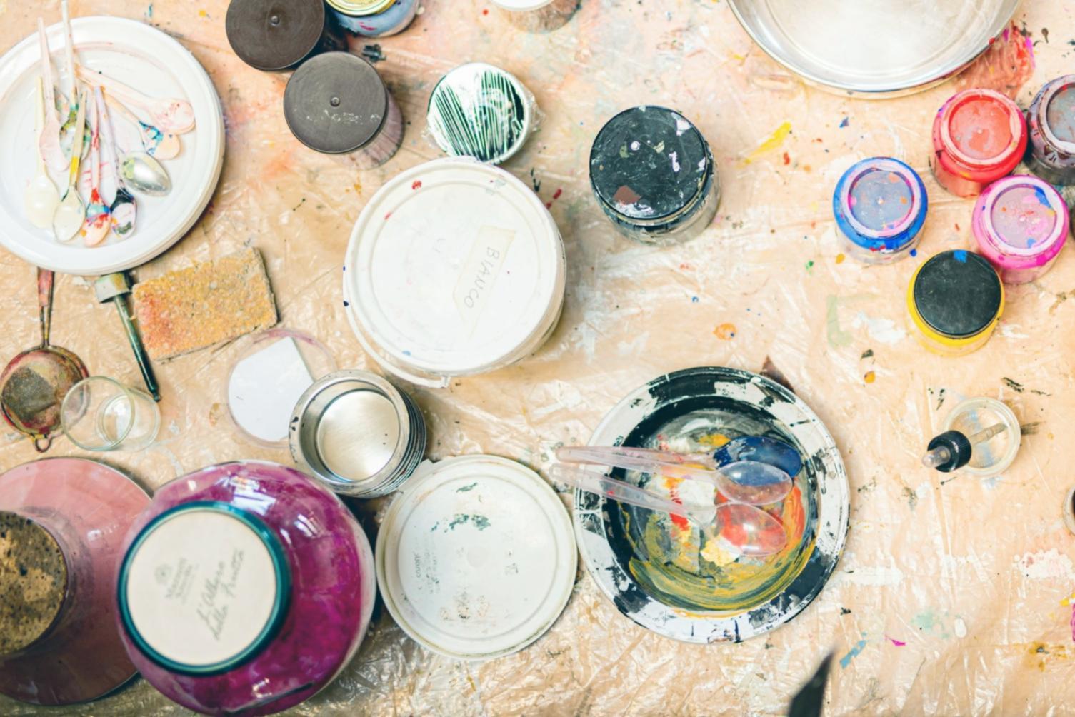 Drawing workspace with art materials and student work